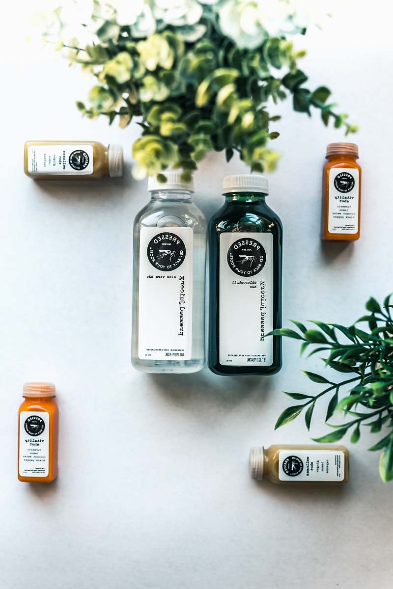 beverage six Pressesed bottles on white surface drink